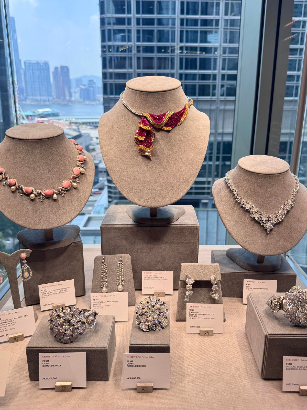 Velvet necklace bust display with city view