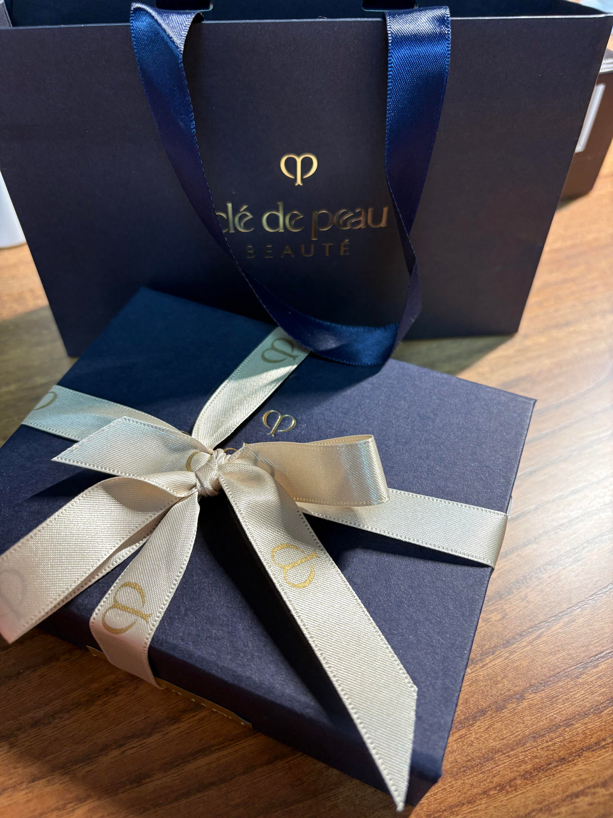 Cle de Peau navy gold luxury gift packaging