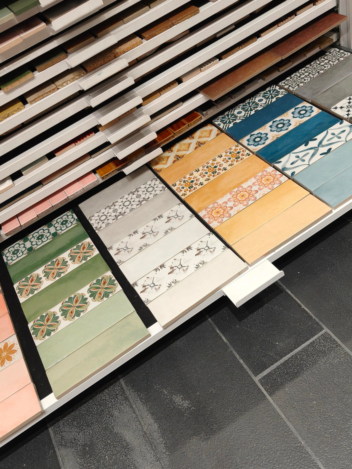 Decorative tile sample rack with floral patterns
