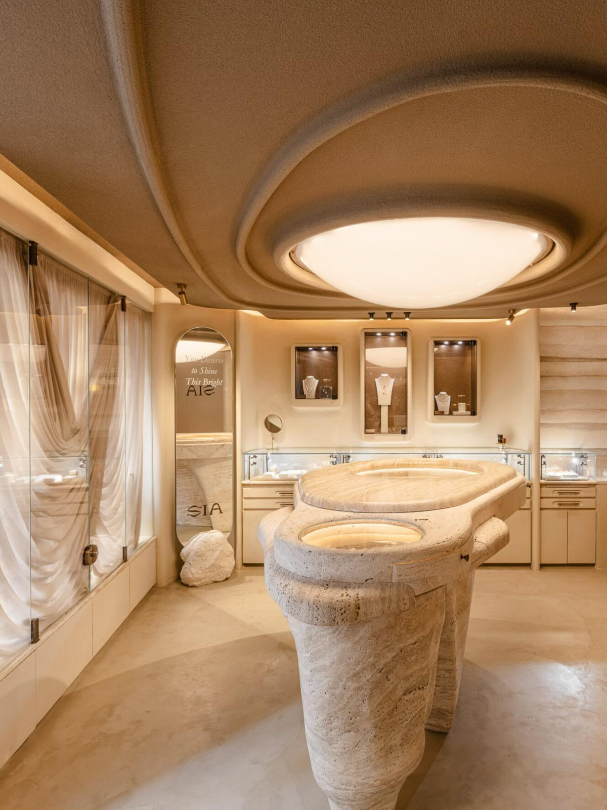 Travertine stone jewelry boutique curved ceiling