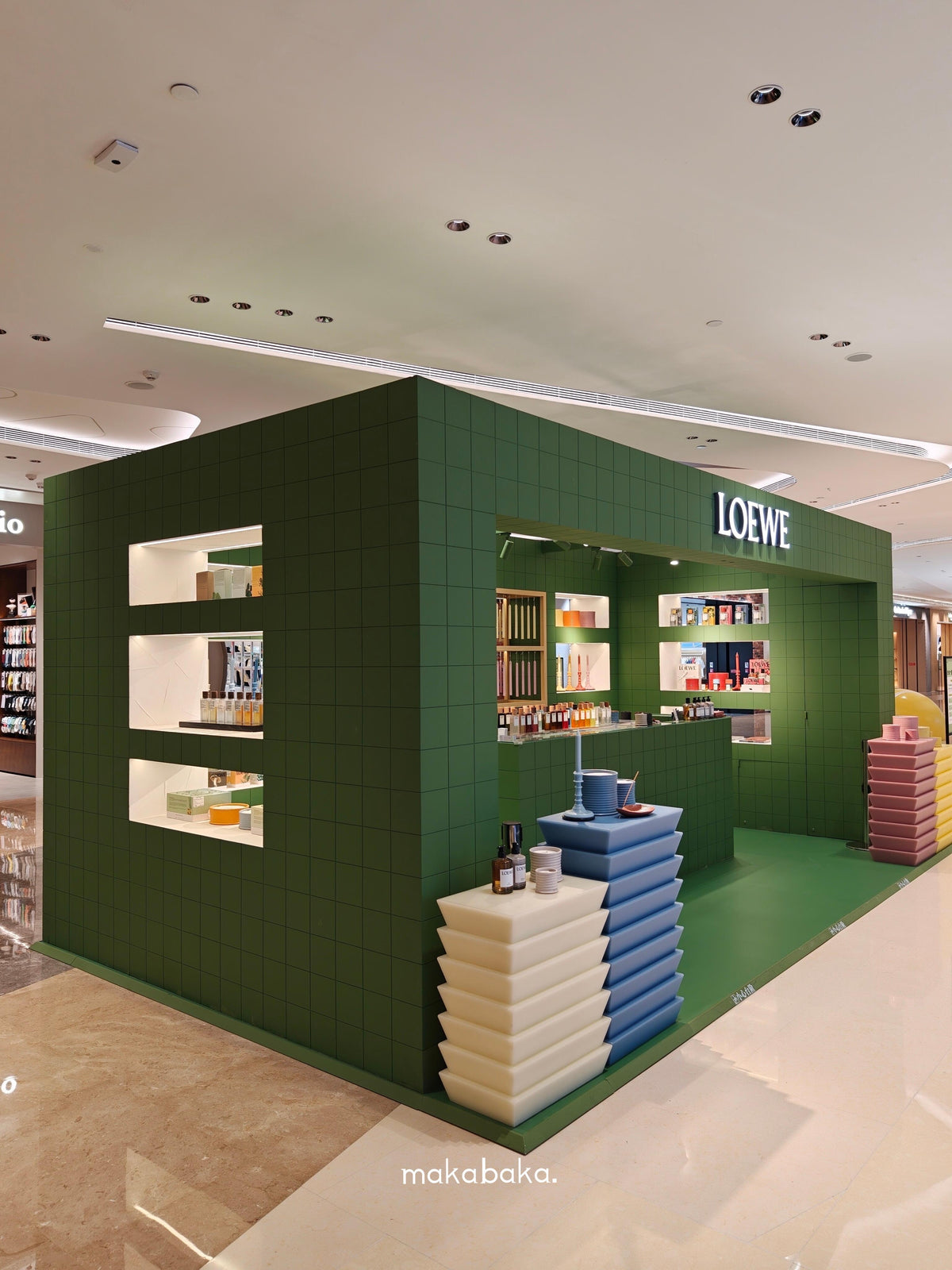 LOEWE green tile pop-up stepped display